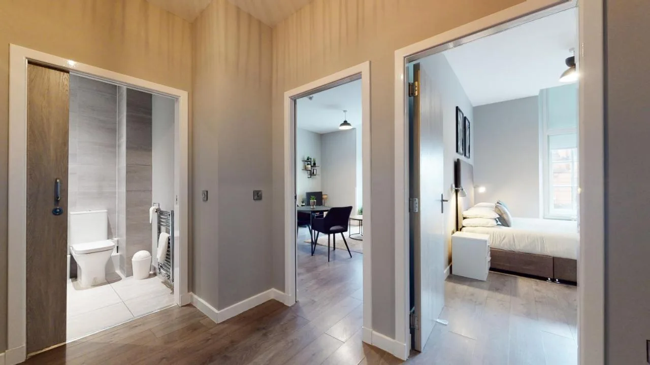 A bedroom with a table and workspace at Glassford Residence in Glasgow